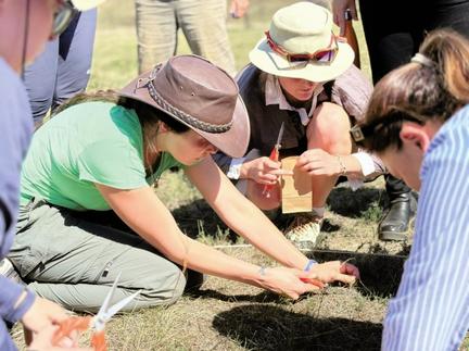 Group of researchers and community conducting field work
